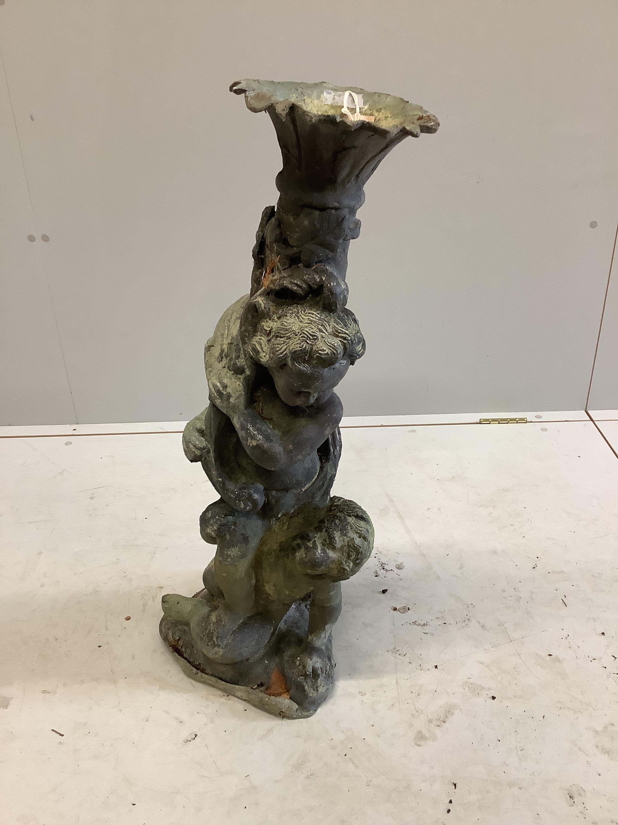 A lead putti garden ornament, height 78cm